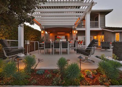 Stock photo of SL Series outdoor grill with island, table and chairs and seating.