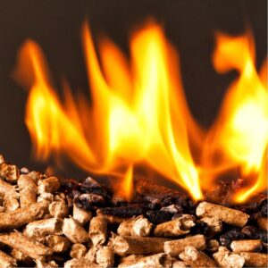a pile of wood pellets with the top portion on fire